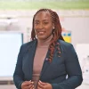 woman-smiling-in-front-of-a-whiteboard-2026-03-18-17-37-21-utc-6a0793510fc5a